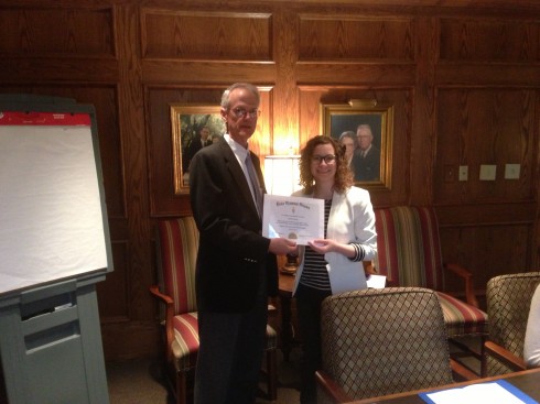 Ashley Crisp receives her certificate of membership