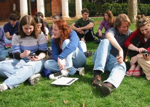 Playing economics games with handheld devices out on the famous UVA lawn with my experimental economics class (that's me on the very far right in the red and my advisor/professor right next to me). This was a big deal since it was WAY before iPads!