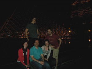 English majors in front of night-time Louvre