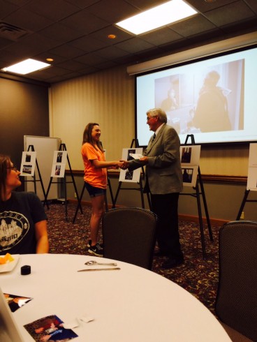 Meagan McBride accepting recognition from Dr. Pruett