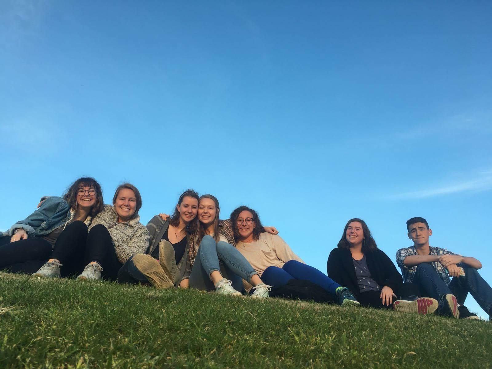  some of us watching a sunset on the hill in the park near our house